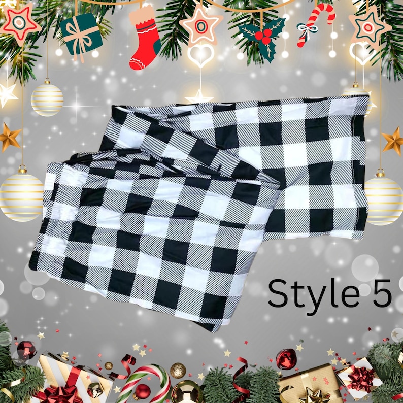 May include: A black and white buffalo check pattern textile, labeled "Style 5". The fabric is folded and displayed against a festive holiday background with ornaments and garland.