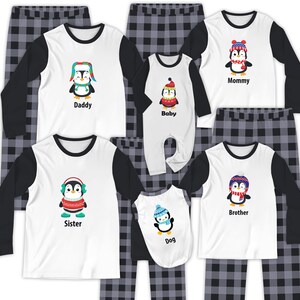 May include: Matching family pyjama sets with penguin designs. The tops are white with black sleeves and penguin graphics, each labelled with family roles. The pyjama bottoms are a grey and black plaid pattern. A fun and coordinated sleepwear collection.