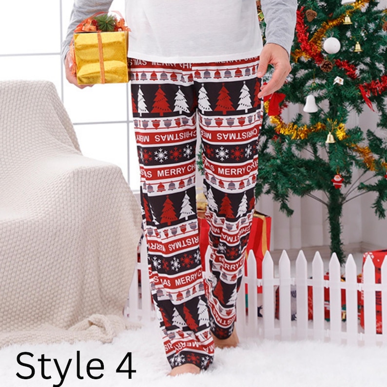May include: Christmas-themed pajama pants in black, red, and white. The pants feature a repeating pattern of Christmas trees, snowflakes, and the words "Merry Christmas." The style is labeled "Style 4."