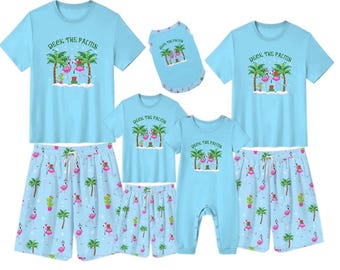 Pijamas navideños tropicales: pijamas familiares a juego Deck the Palms, pijamas playeros con flamencos y palmeras, conjunto navideño azul.