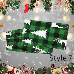 May include: Green and black plaid Christmas pajama pants with white Christmas trees and reindeer. The text "Style.7" is visible on the bottom right of the image. Festive holiday apparel.