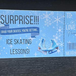 May include: A blue and white gift certificate with a snowflake design. The text reads "Surprise!!! Grab your skates, you're getting... Ice Skating Lessons!" and "To: Elsie Love: Nanna & Grandad Merry Christmas!"