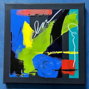 May include: Abstract acrylic painting on a square canvas. The artwork features bold brushstrokes in blue, yellow, green, red, and black against a dark grey background. White lines and shapes add contrast. The painting is a modern art piece.