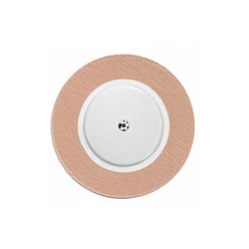 Pu&ograve; includere: Un cerotto adesivo medico rotondo beige con un centro bianco e un piccolo punto nero al centro.