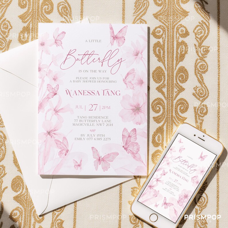 An elegant flat lay image featuring a soft pink baby shower invitation card surrounded by beautiful pink and white floral arrangements and paper butterfly decorations. The card includes delicate watercolor butterfly illustrations and sophisticated pink script typography that reads "A Little Butterfly is On the Way," inviting guests to a baby shower honoring Wanessa Tang. Soft shadows and natural light add depth to the image, creating a romantic, refined.