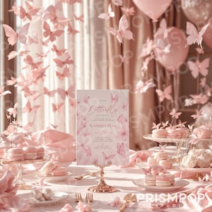 An elegant, pastel-themed setting showcases a butterfly-inspired baby shower invitation held on a gold stand, surrounded by luxurious elements including soft pink silk fabric, blush-toned balloons, and intricate paper butterfly decorations gracefully floating throughout the scene. The invitation design features delicate pastel-pink watercolor butterflies and floral details with refined typography that reads "A Little Butterfly is on the Way," celebrating Wanessa Tang.