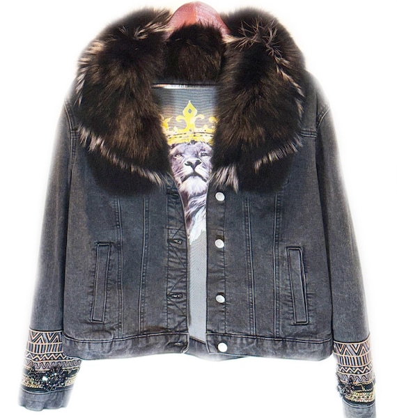 Upcycled stone-washed denim jacket with black fox fur collar and cuffs and a rhinestone feather   back detail
