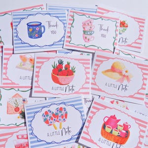 May include: A collection of watercolor greeting cards with various designs. Some cards say "Thank You" and others say "A Little Note." Designs include a teacup, strawberries, a sun hat, and a teapot with teacups. The cards have pink and white striped borders.