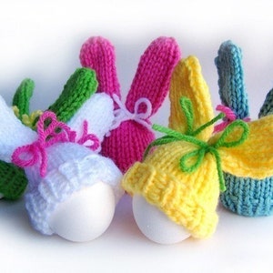 Colorful knit egg hat bunnies with bow ties.