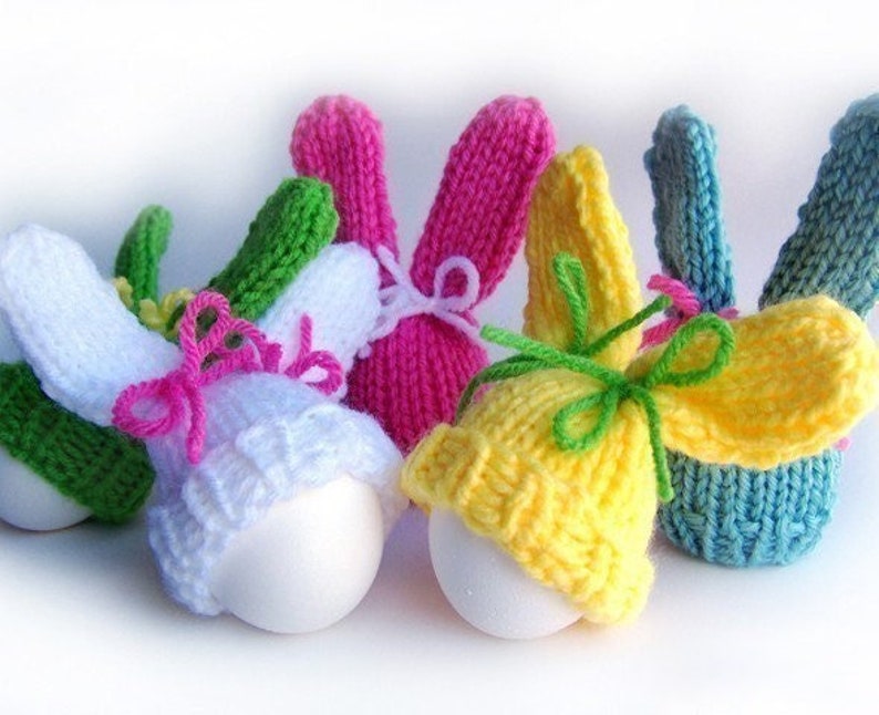 Colorful knit egg hat bunnies with bow ties.