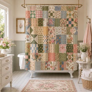 May include: A patchwork shower curtain featuring a grid of squares with various floral, gingham, and striped patterns in shades of pink, green, blue, and cream. The curtain hangs from a gold rod above a white clawfoot bathtub in a bathroom setting.