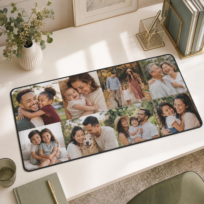 May include: A rectangular desk mat featuring a collage of multiple color photographs depicting various family members, couples, and a dog in outdoor and indoor settings. The mat has a black border and a smooth surface for use on a desk workspace.