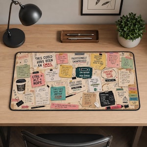 May include: A rectangular desk mat featuring a collage of office-themed sticky notes, checklists, and humorous text like "This Could Have Been An Email" and "Deadline Panic Club" printed on a beige background with various office supply illustrations.
