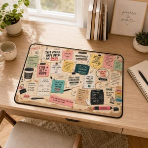 May include: A rectangular desk mat featuring a collage of colourful sticky notes, paper scraps, and office-themed doodles. The notes contain humorous text such as This Could Have Been An Email, Ctrl+Alt+Nope, and Office Chaos Coordinator.