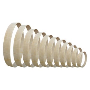 May include: A set of ten circular wooden hoops arranged in a descending size order from left to right. Each hoop features a light beige natural wood grain texture, a smooth finish, and a thin, flexible band construction with a consistent width.