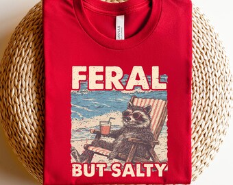 Feral But Salty Shirt, Funny Beach Raccoon Tee, Retro Coastal Humor Gift, Summer Vacation Graphic Unisex Crewneck T-Shirt