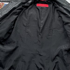 May include: Black leather jacket with a red label that says "Double Zero" inside the jacket.