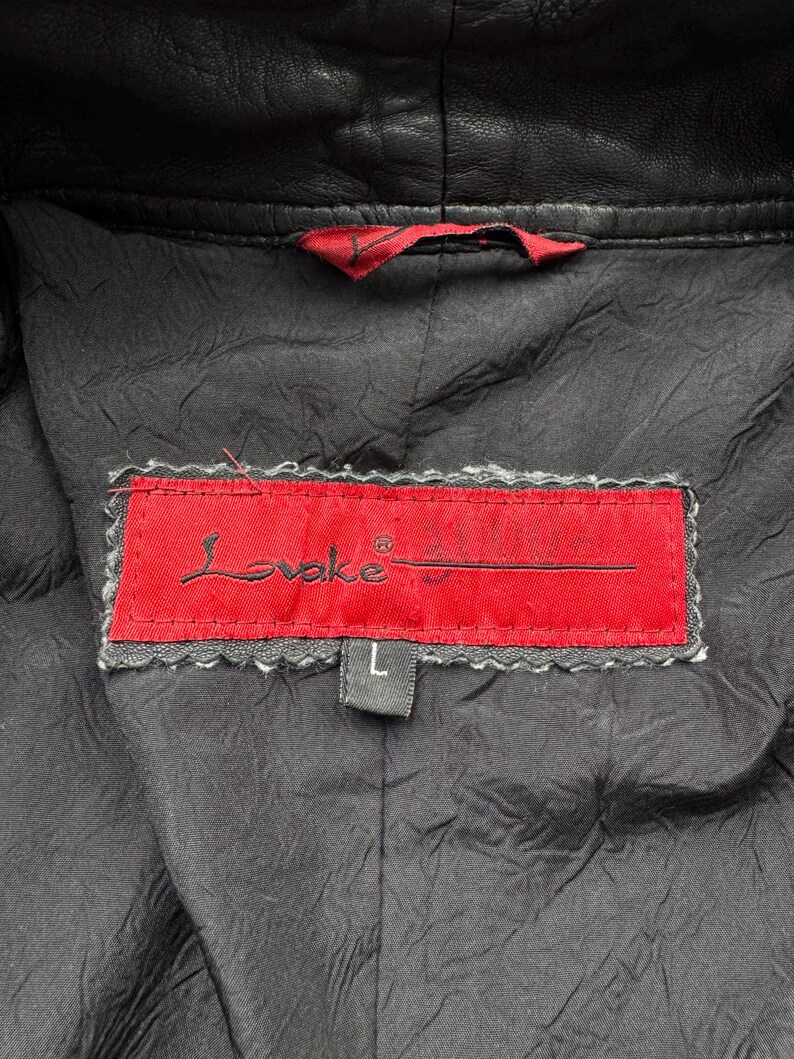 May include: A black leather jacket with a red label that says "Loveke" and a size "L" tag.