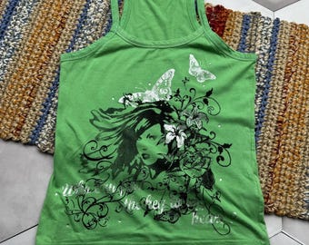 May include: Green tank top with a black and white graphic of a woman's face with butterflies and flowers. The text "with you in my heart" is printed on the front.