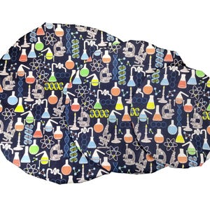 May include: Three round fabric placemats with a navy blue background and a repeating pattern of colorful beakers, microscopes, and DNA strands.