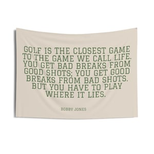 a quote in green text that says, "Golf is the closest game to the game we call life. You get bad breaks from good shots; you get good breaks from bad shots. But you have to play where it lies." - Bobby Jones