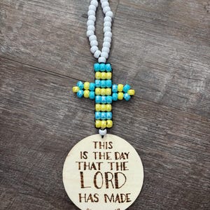 This is the day car charm with beaded cross for rear view mirror