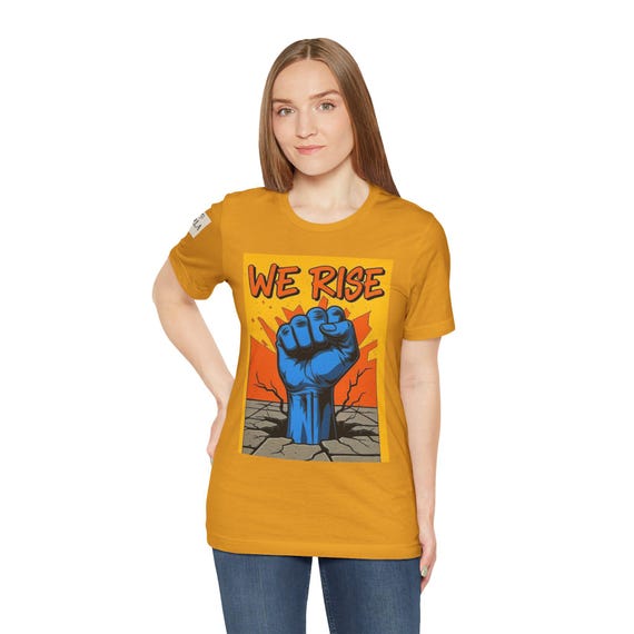 Empowering Graphic Tee, We Rise Fist Shirt, Unisex activism wear, Protest attire, Motivational gift, Everyday statement top