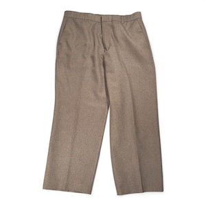 May include: A pair of tan-colored trousers with a classic, straight-leg design. The pants feature a button and zipper closure, belt loops, and front pockets. The fabric appears to be a medium-weight material, suitable for various occasions.