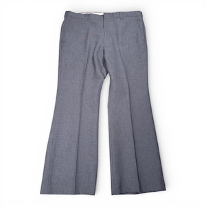 May include: Gray flared trousers with a classic design. The pants have a high waist and a wide leg, with a subtle texture. The trousers are made of a medium-weight fabric and are suitable for various occasions.