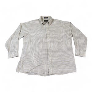 May include: A long-sleeved button-down shirt with a classic plaid pattern in beige, brown, and navy blue. The shirt has a button-down collar and buttoned cuffs. The fabric appears to be a lightweight woven material.