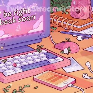 May include: A pink and blue computer monitor with the text "be right back soon" on the screen. The monitor is on a desk with a pink keyboard, a pink mouse, a pink and orange cell phone, a pink and white notebook, a pink camera, a glass of pink boba tea, and green plants.