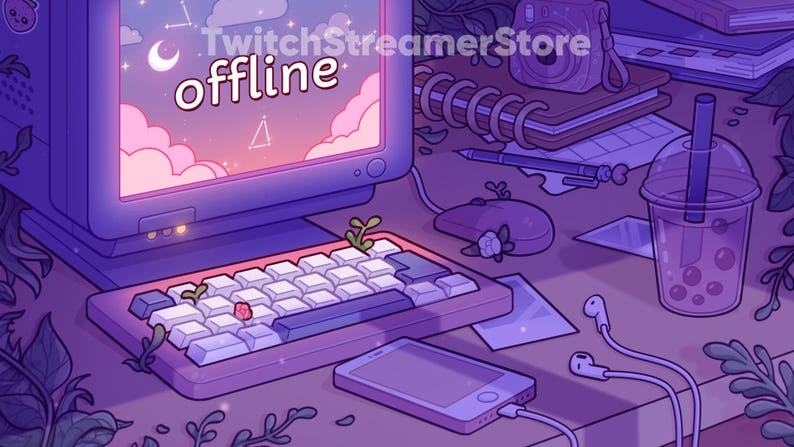 May include: A purple and pink computer monitor with the text "TwitchStreamerStore offline" displayed on the screen. The monitor is on a desk with a keyboard, a phone, a notebook, a camera, and a glass of boba tea.