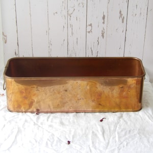 Vintage kopparplanter med ringhandtag på sidan