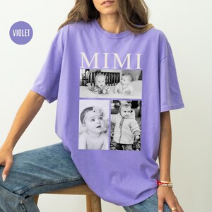 May include: A purple t-shirt with the word "MIMI" printed in white on the front. The shirt features four black and white photos of babies.