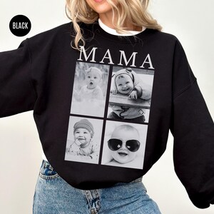 May include: Black sweatshirt with the word "MAMA" in white block letters. The sweatshirt features a collage of four black and white baby photos. The word "BLACK" is in a black circle in the upper left corner.
