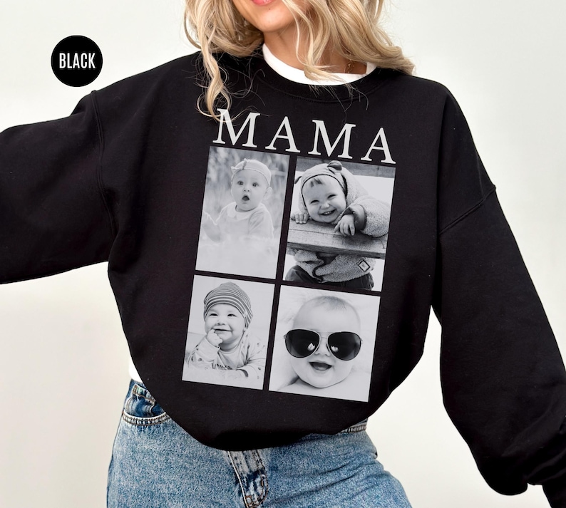 May include: Black sweatshirt with the word "MAMA" in white block letters. The sweatshirt features a collage of four black and white baby photos. The word "BLACK" is in a black circle in the upper left corner.