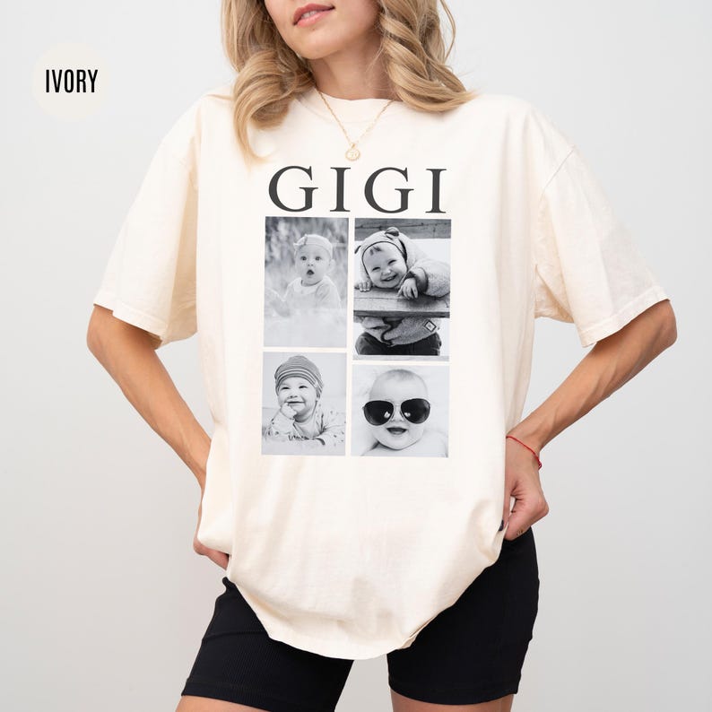 May include: Ivory t-shirt with the word "GIGI" printed in black on the front. The shirt features four black and white photos of babies in a grid pattern.