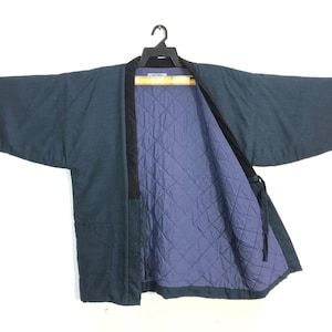 May include: A set of three ceramic mugs with a speckled, matte finish. The mugs are in shades of cream, light gray, and dark gray. Each mug has a simple, minimalist design, perfect for coffee or tea.