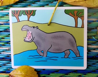 Sticker vinyle hippopotame : hippopotame dans une scène aquatique