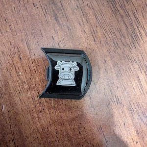 Mooey with black badge