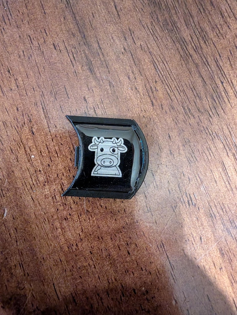 Mooey with black badge