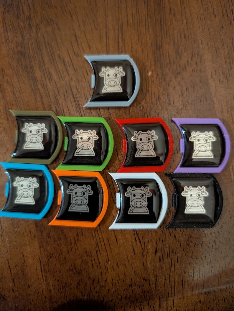 Various colored Mooey badges