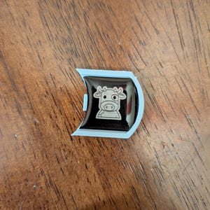 Mooey with silver badge
