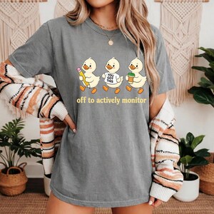 Off To Actively Monitor Goose Comfort Colors T-Shirt, Funny Teacher Goose Gift, Testing Day Graphic Tee