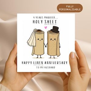 May include: A square greeting card featuring a cartoon illustration of two linen rolls holding hands. The left roll wears a white veil and the right roll wears a black top hat. Text reads: 4 YEARS MARRIED... HOLY SHEET, HAPPY LINEN ANNIVERSARY TO MY HUSBAND.