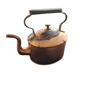 May include: Antique copper tea kettle with a dark wooden handle and brass accents. The kettle has a spout and a lid with a small knob. The copper has a patina, giving it a vintage look. The handle is curved and attached to the body.