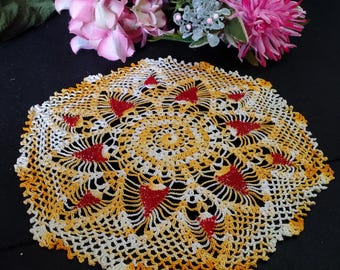 VINTAGE CROCHET DOILY. Gorgeous tangerine orange & white variegated thread, with red bead accents incorporated in this pineapple design.