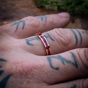 Rose Gold Faceted Tungsten Ring with Ruby Red Opal Inlay (Men’s Wedding Band)
