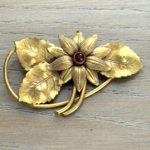 Vintage Gold Tone Metal Floral Leaf Brooch Pin Red Stone Statement Curved