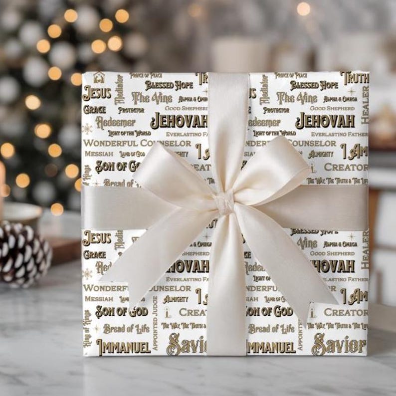 May include: A wrapped gift with white paper featuring religious words like "Jesus" and "Jehovah" in a repeating pattern. The gift is tied with a cream-colored satin ribbon and bow, perfect for a religious occasion.